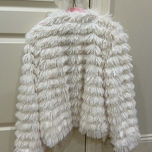 White furry jacket